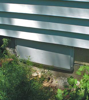 A gray crawl space vent cover in Fayette