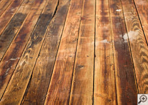 A Penn Yan wood floor displaying water damage.