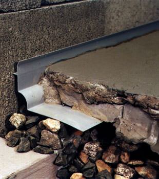 a custom designed basement drain system for thin basement floors in Stanley.