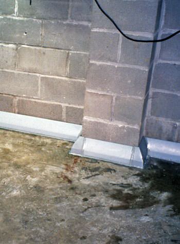 Baseboard weeping tile system for homes with monolithic foundations and thick floors