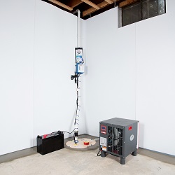 Sump pump system, dehumidifier, and basement wall panels installed during a sump pump installation in Romulus