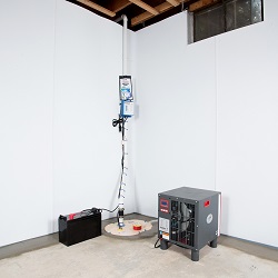 a complete basement waterproofing system installed in a Farmington home